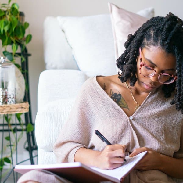 Woman writing in journal