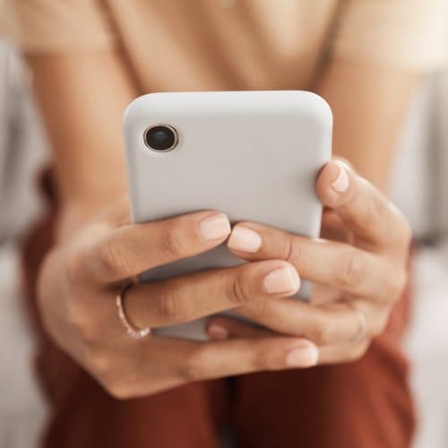 Hands holding phone